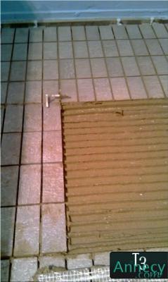 Collage mosaïque douche italienne